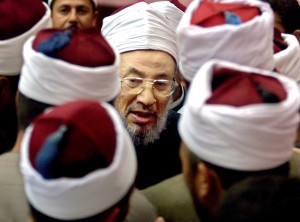 Il religioso Yusuf al Qaradawi: "Unitevi ai ribelli contro Assad" (Afp)